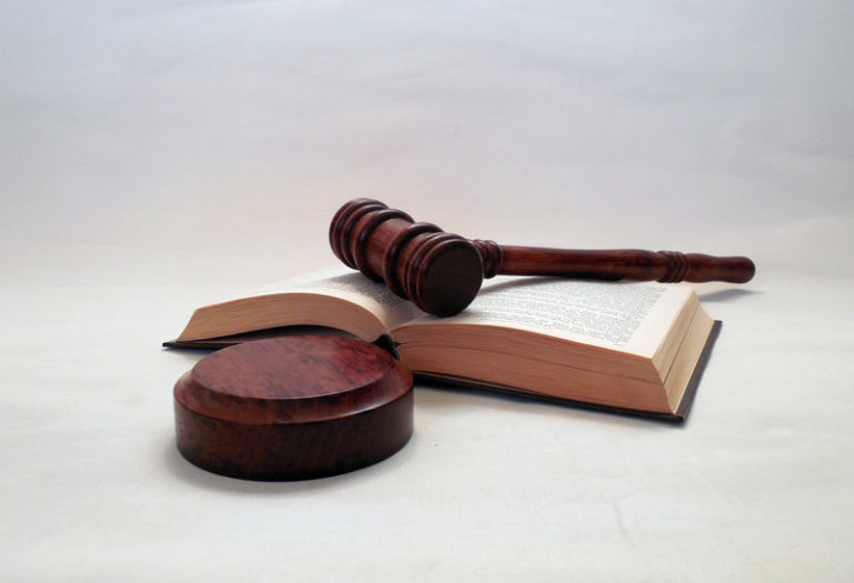 A gavel on top of a book